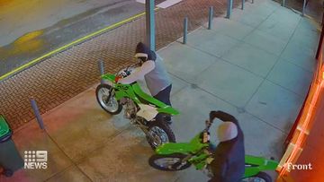 The robbers stole two Kawasaki dirt bikes from the shop. 