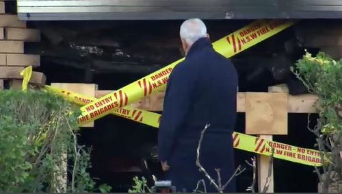 Chris Al Cheikh looks at his burnt out home. Image: 9News