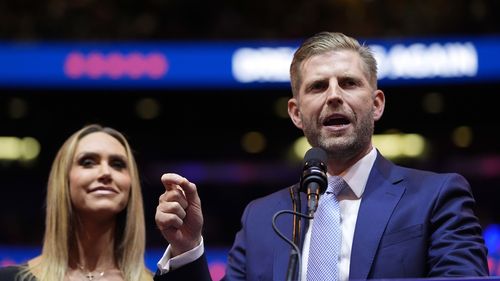 Eric Trump and his wife Lara speak before Republican presidential nominee former President Donald Trump at a campaign rally at Madison Square Garden, Sunday, Oct. 27, 2024, in New York. (AP Photo/Alex Brandon)