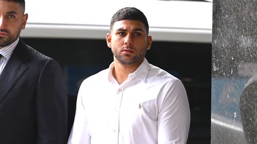 Amateur boxer Adam Abdallah (right) arrives at the Downing Centre Local Court, in Sydney, Wednesday, February 26, 2025. (AAP Image/Dean Lewins)