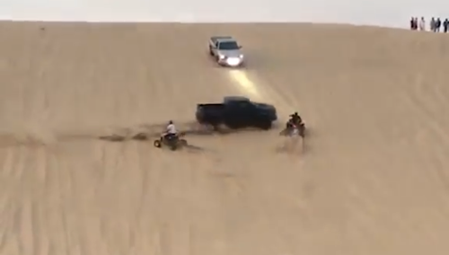 Footage shows the quadbiker ride directly into the path of the racing ute.