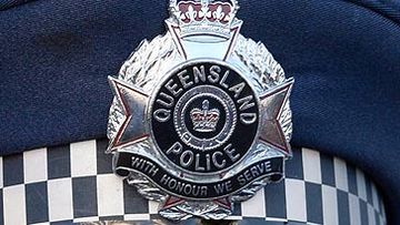 Queensland Police badge on cap (Getty)