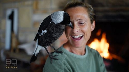 Sam and Penguin, the bird who saved her life.