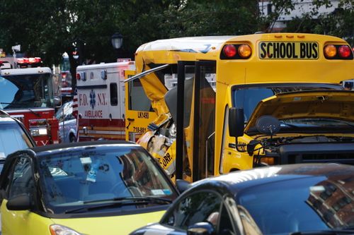 Authorities respond near a damaged school bus. (AP)