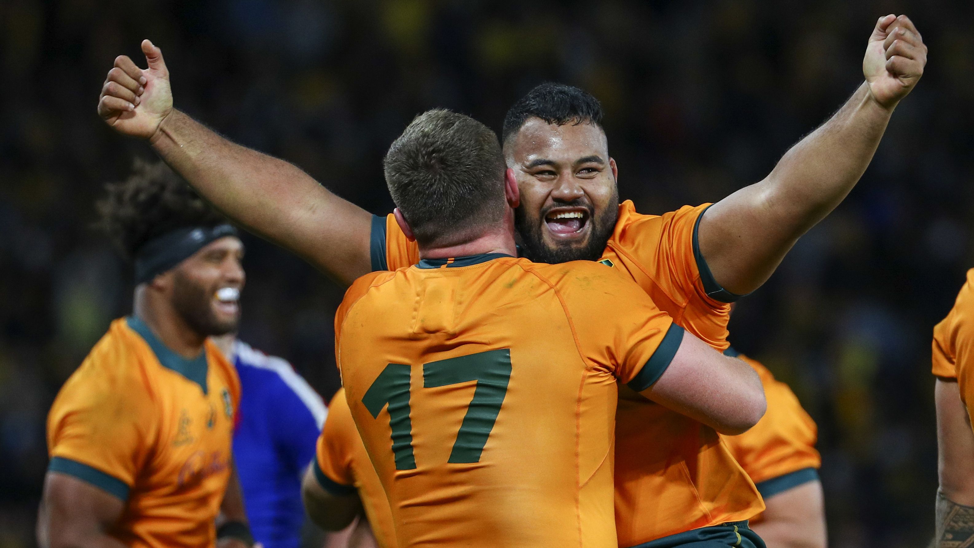 Australia&#x27;s Taniela Tupou and Angus Bell celebrate after defeating France.