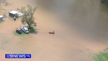 Man’s body found in floodwaters as Queensland smashed by rain
