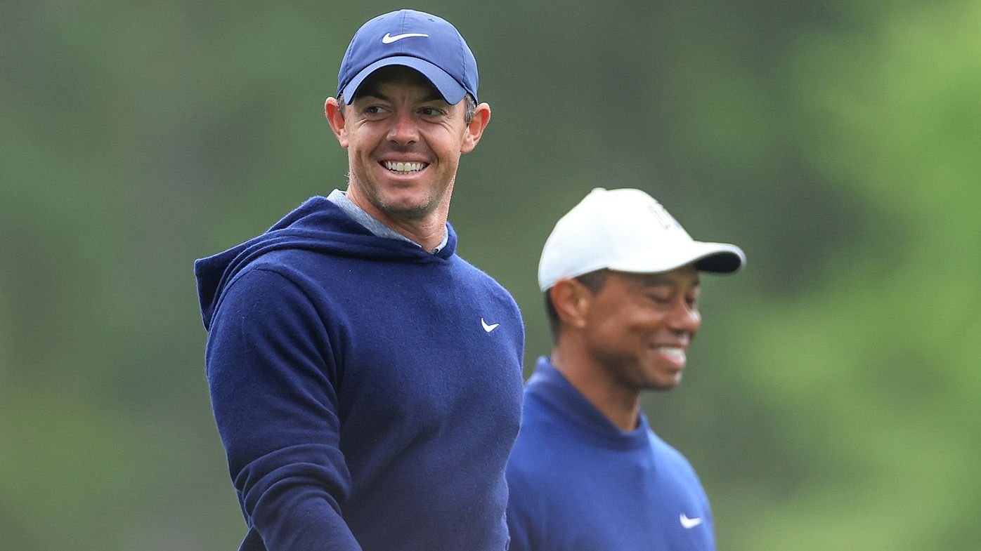 Rory McIlroy of Northern Ireland and Tiger Woods of The United States walk together off the tee on the 12th hole during a practice round prior to the 2023 Masters Tournament at Augusta National Golf Club on April 03, 2023 in Augusta, Georgia. (Photo by David Cannon/Getty Images)