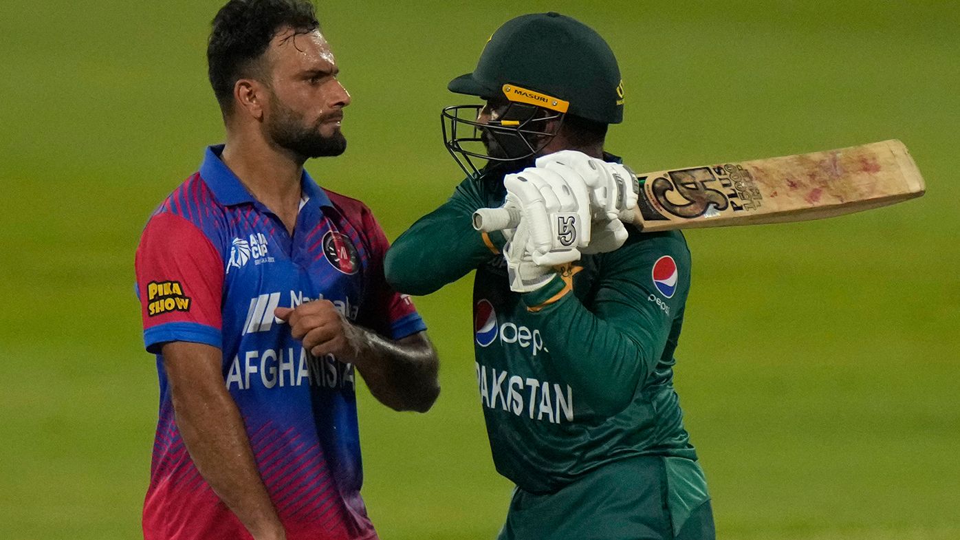 Afghanistan&#x27;s Fareed Ahmad, left, and Pakistan&#x27;s Asif Ali, right, react after Ali was dismissed in their Asian Cup match.