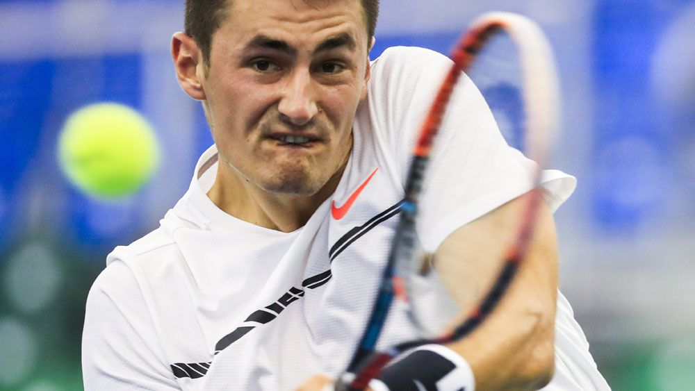 Bernard Tomic has withdrawn from the Miami Open, citing a back injury. (AAP)