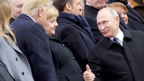 Russian President Vladimir Putin gives US President Donald Trump a thumbs up as he arrives at a ceremony in Paris marking 100 years since the end of WWI.