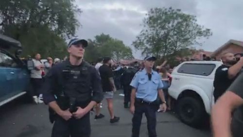 Hundreds of people swarmed a protest outside a Mark Latham speaking event in Sydney's south-west.