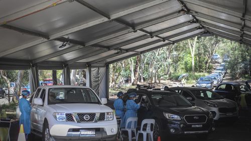 Cars at the pop up Covid Testing Centre at Frenchs Forest Aquatic Centre Drive in Sydney..