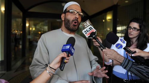 Muslim cleric Man Haron Monis speaks to the media as he leaves the Downing Centre in 2011.