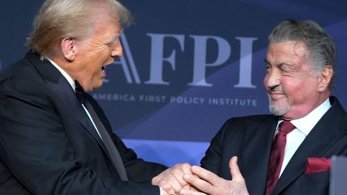 Donald Trump on stage with Sylvester Stallone.