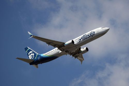 A Boeing 737-990 operated by Alaska Airlines takes off from JFK Airport.
