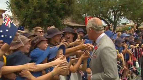 Prince Charles is greeted by a mob of enthusiastic school kids. (Nine News)