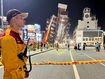 A rescue worker stands near the cordoned off site of a leaning building in the aftermath of an earthquake in Hualien, eastern Taiwan on Wednesday, April 3, 2024