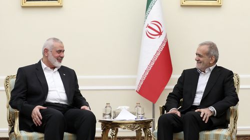 President Masoud Pezeshkian (right) meets Hamas chief Ismail Haniyeh at the President's office in Tehran, Iran on July 30.