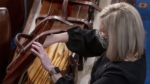 Boxes containing Electoral College votes are opened as a joint session of the House and Senate