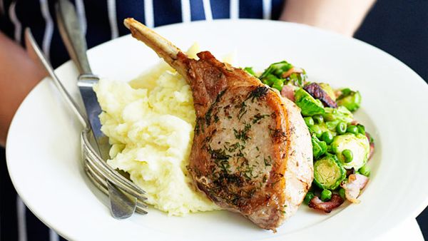 Pork cutlets with bacon, brussels sprouts and peas