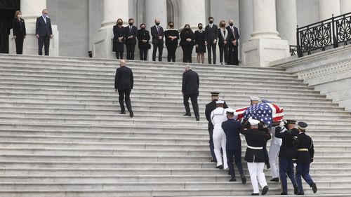 The flag-draped casket of Justice Ruth Bader Ginsburg arrives at the US Capitol, where Ginsburg will lie in state Friday, Sept. 25, 2020, in Washington.