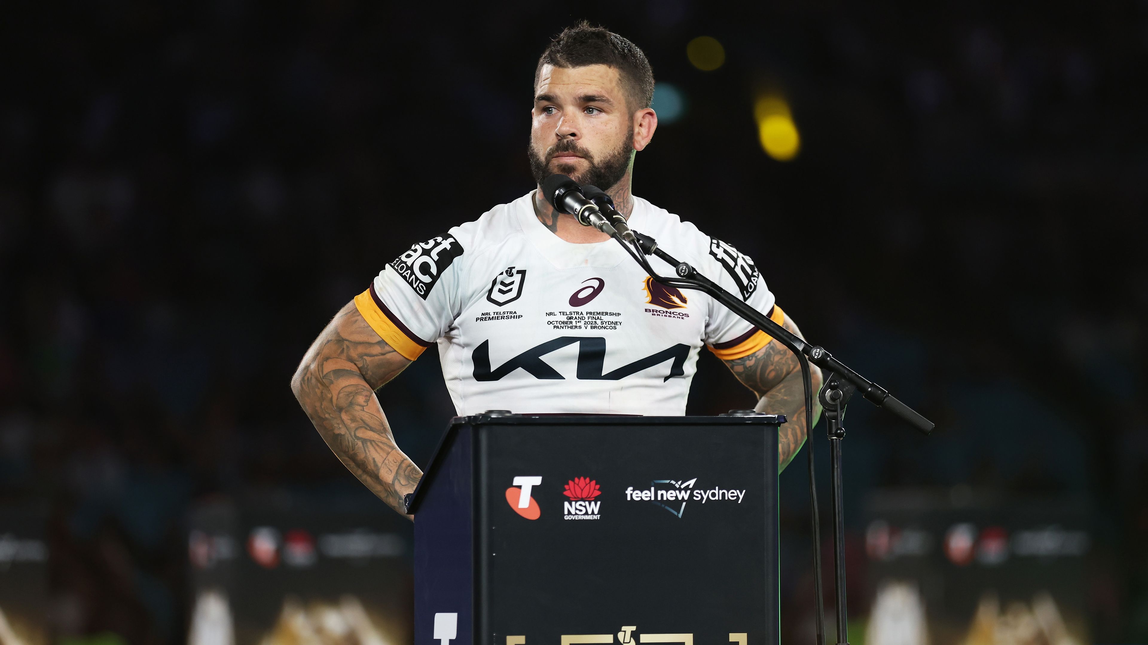 SYDNEY, AUSTRALIA - OCTOBER 01:  Adam Reynolds of the Broncos speaks on stage after the 2023 NRL Grand Final match between Penrith Panthers and Brisbane Broncos at Accor Stadium on October 01, 2023 in Sydney, Australia. (Photo by Matt King/Getty Images)
