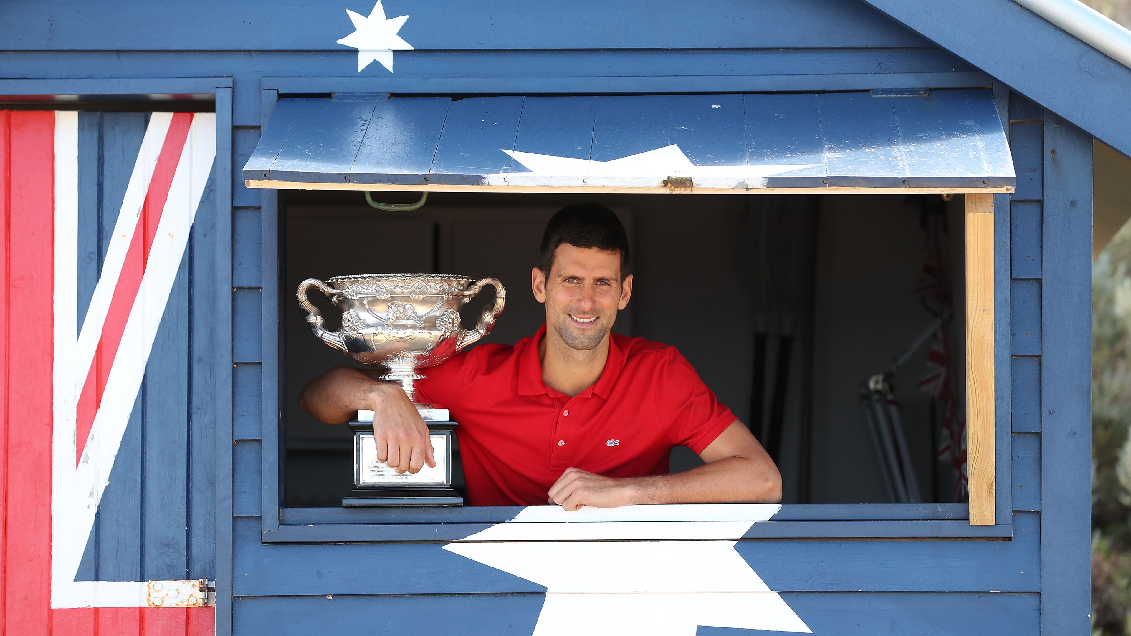 Novak Djokovic in guarded room after landing in Australia as father speaks out