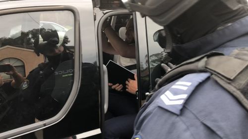 At least one man was arrested at a raided home. (NSW Police)