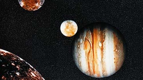 Photograph of Jupiter and its moons from Voyager (Getty)