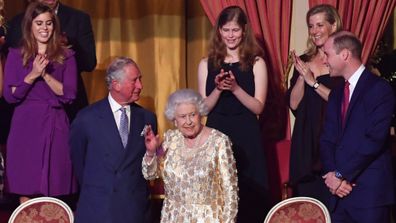 Queen Elizabeth II, surrounded by members of the royal family, takes her seat at the Royal Albert Hall in London. (PA)