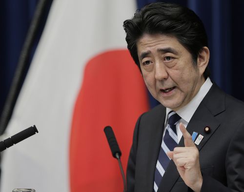 Then Japanese Prime Minister Shinzo Abe speaks during a news conference on Trans-Pacific Partnership or TPP at his official residence in Tokyo, Friday, March 15, 2013.