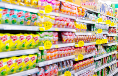 Supermarket blurred junk food on special