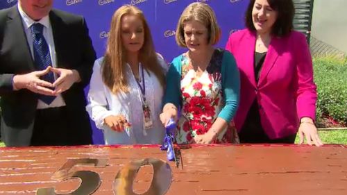 The super-sized sweet treat was cut up for the masses to enjoy. (9NEWS)