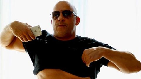 Vin Diesel lifts his shirt to the haters.