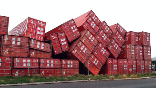 Winds blew over 30 sea containers at Rous Head, weighing 4 tonne each. (9NEWS)