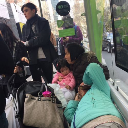 Injured passengers wait for emergency services at the corner of Spencer and Bourke Streets. (Twitter)