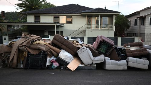 LISMORE, AUSTRALIA - MARCH 02:  Discarded furniture outside a flood affected property on March 02, 2022 in Lismore, Australia. Several northern New South Wales towns have been forced to evacuate as Australia faces unprecedented storms and the worst flooding in a decade. (Photo by Dan Peled/Getty Images)