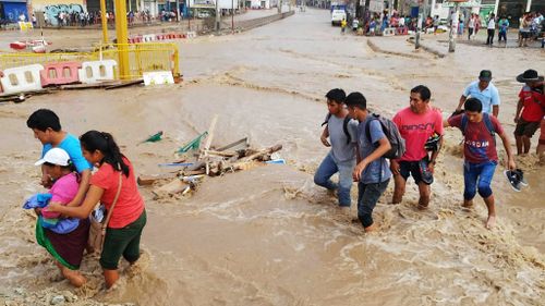 At least seven people dead in Peru landslide as floods hit Lima