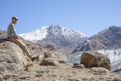 In this Oct. 2019 handout photo provided by Kensington Palace and released on Tuesday, Dec. 31, 2019, Britain's Prince William sits at a glacier in the Hindu Kush mountain range, situated in the Chitral District of Pakistans Khyber-Pakhtunkwa Province. Prince William is kick-starting 2020 with a new drive to dispel the current pessimism around the environment and replace it with fresh optimism and action, by announcing The Earthshot Prize: an ambitious set of challenges initiating global, cross-