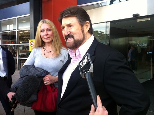 Beaming broadcaster Derryn Hinch with his teary wife Chanel Hayton, leaves Austin Hospital after receiving a liver transplant last week in Melbourne, Saturday, July 16, 2011. (AAP)