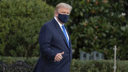 President Donald Trump gives thumbs up as he leaves the White House to go to Walter Reed National Military Medical Centre.