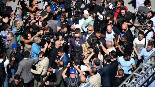 McGregor interacts with media outside T-Mobile Arena. (Getty)