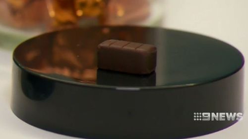 The process isn't as simple as melting a Cadbury chocolate bar and putting a tablet inside.