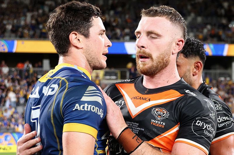 Mitchell Moses of the Eels congratulates Jackson Hastings of the Wests Tigers after kicking the winning field goal during their round six NRL match. 