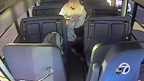 The bus driver is then seen grabbing the girl from her seat and throwing her to the ground. (Supplied)