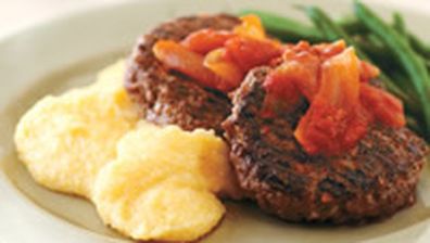 Beef rissoles with polenta and tomato onion sauce