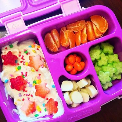 "Aria's bento for today," posts Mum, Laura Oakley. "She now demands a "special" lunch everyday. I have created a monster! Yoghurt with strawberry hearts and sprinkles, a cutie, cucumber, string cheese and yogurt dipped raisins.