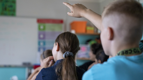 Children sit for the first day of classes of the new school year at the GuthsMuths elementary school during the coronavirus pandemic on August 10, 2020 in Berlin, Germany. 