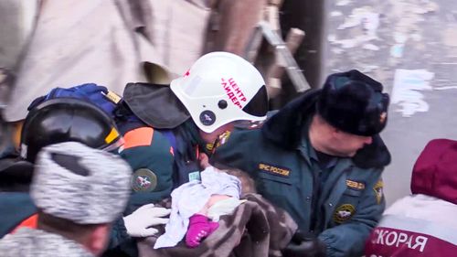 Rescuers heard crying and were able to reach the infant, despite temperatures being as low as -22C.

They spotted his leg and a pink sock.