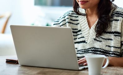 Woman using computer at home